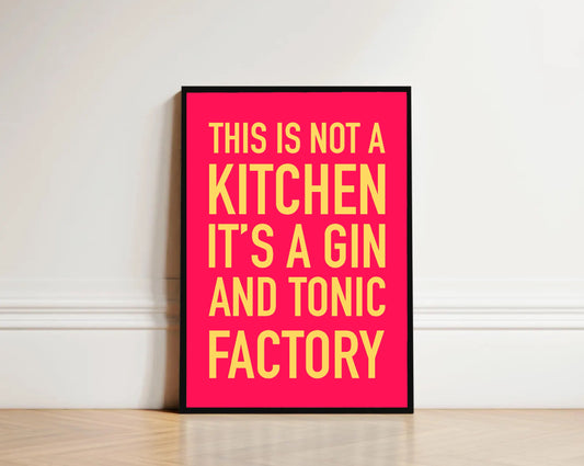 Framed poster with yellow text on a pink background against a white wall.